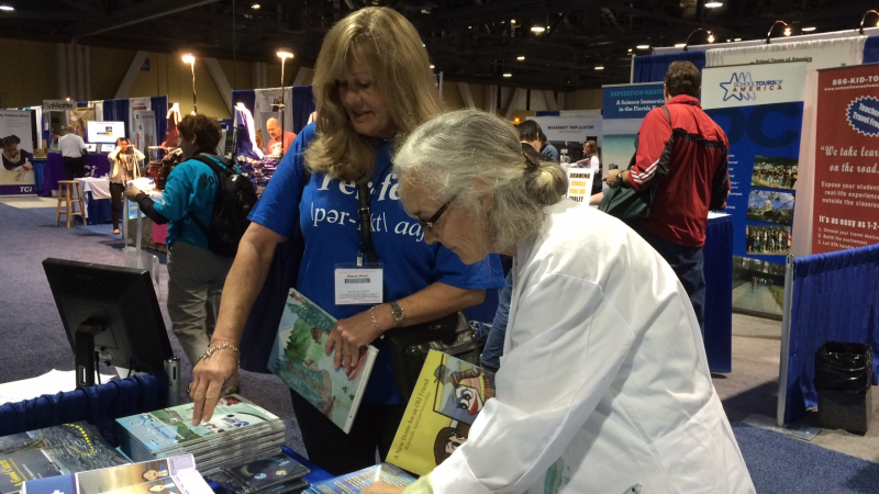 Linda Chilton, right, an educator with University of Southern California Sea Grant, meets with science teachers at the National Science Teachers Association Conference in Long Beach, California. 
