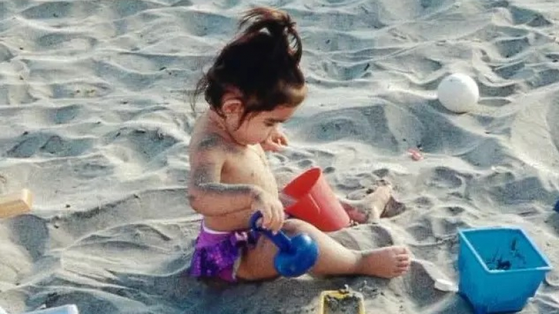 Jezella Peraza, as a baby, playing in the sand and soaking up the sun in San Felipe, Baja California, Mexico. 