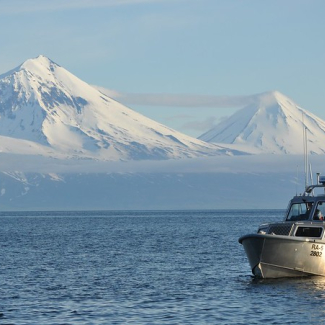 RAINIER launch RA-5 underway off Alaska Peninsula. Pavlof Volcano and Pavlof Sister are in the background.