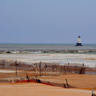 (High water conditions during the Lake Michigan meteotsunami event near the Ludington Breakwater Lighthouse on April 13, 2018.