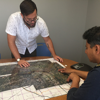 Jeremy Hoffman, a climate and earth scientist at the Science Museum of Virginia, left, and Vivek Shandas, a professor of urban studies and planning at Portland State University, design the routes that citizen scientists will later take to collect heat data for mapping Richmond's heat islands earlier this year. 
