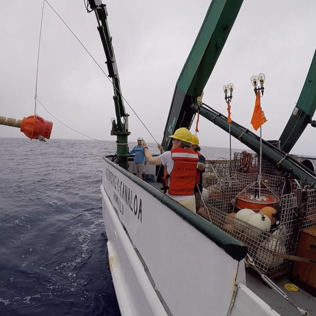 Scientists deploy a Deep Argo float in 2018 from Research Vessel Kaʻimikai-O-Kanaloa at the Pacific Ocean off Hawaii. The ocean robot will track ocean temperature, salinity and other data down to 3 to 4 miles deep in the ocean.