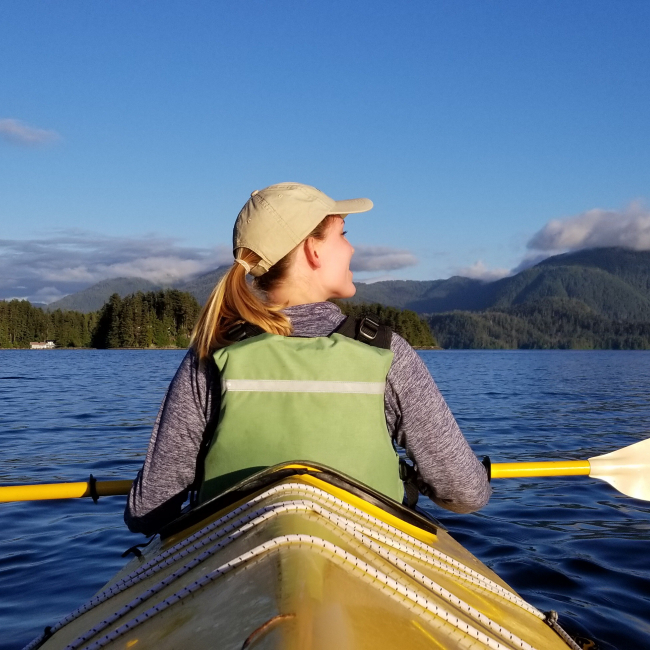 Savannah Miller, a 2018 NOAA Hollings scholar, takes in the scenery while kayaking in the Sitka Sound in Sitka, Alaska, during her summer internship.